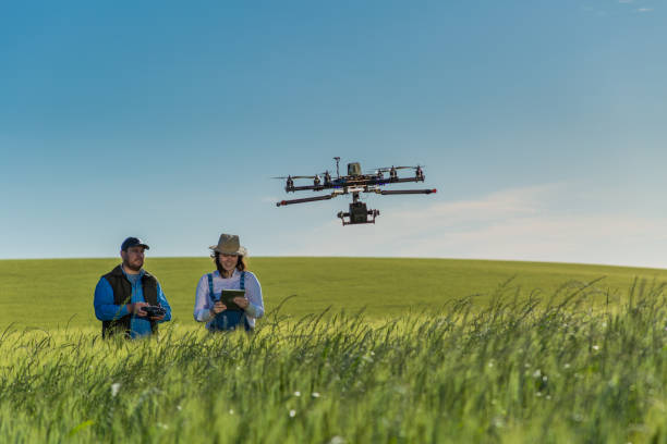 A drone flying over a field, capturing crop health data.