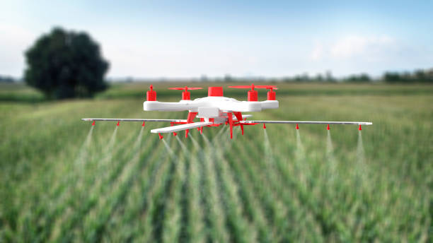 A drone spraying pesticides over a field, showcasing precision agriculture in action.