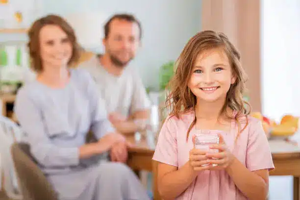 A family enjoying a glass of milk together, highlighting its role in promoting health across all ages - Milk Nutrition Facts & Health Benefits