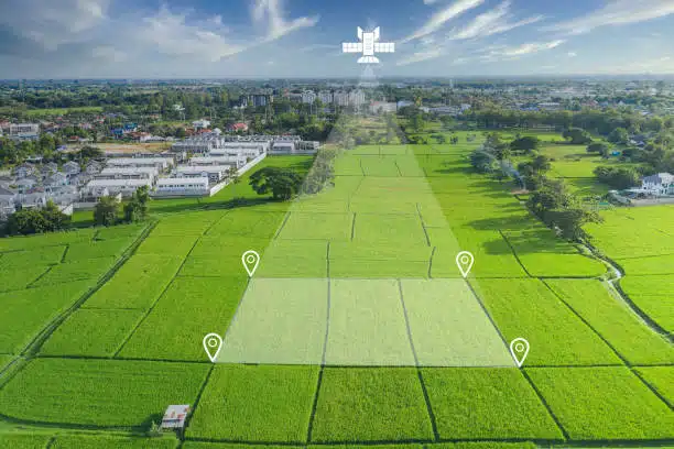 A satellite image of farmland showing variable crop health zones - Precision Farming