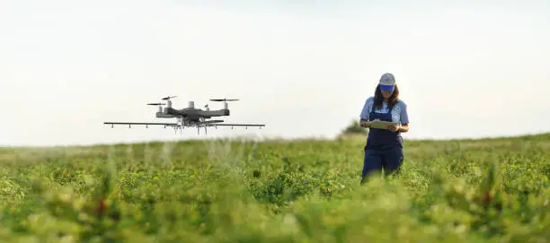 A futuristic farm with drones and autonomous machinery working in harmony - Agriculture Science Definition & The Future